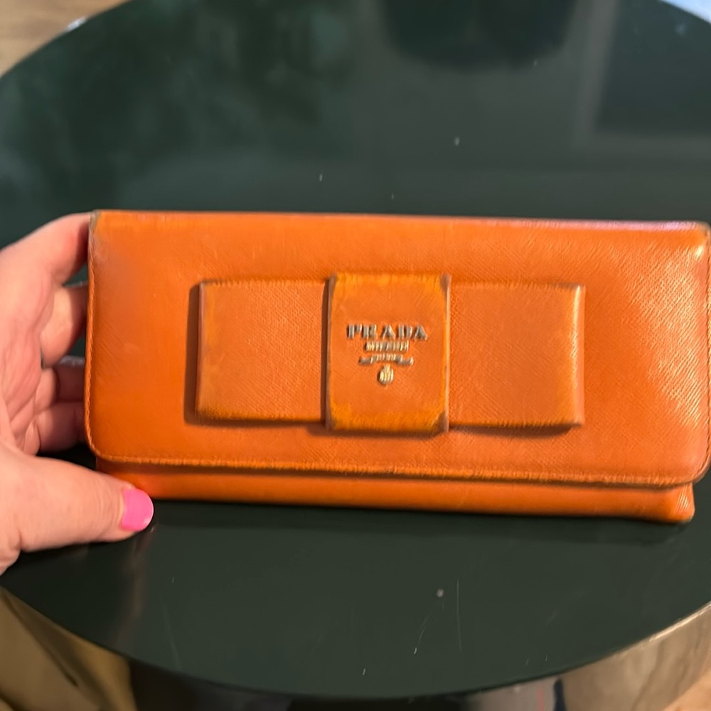 Prada certified wallet. Nice size. Very good  interior. wear on front & edges